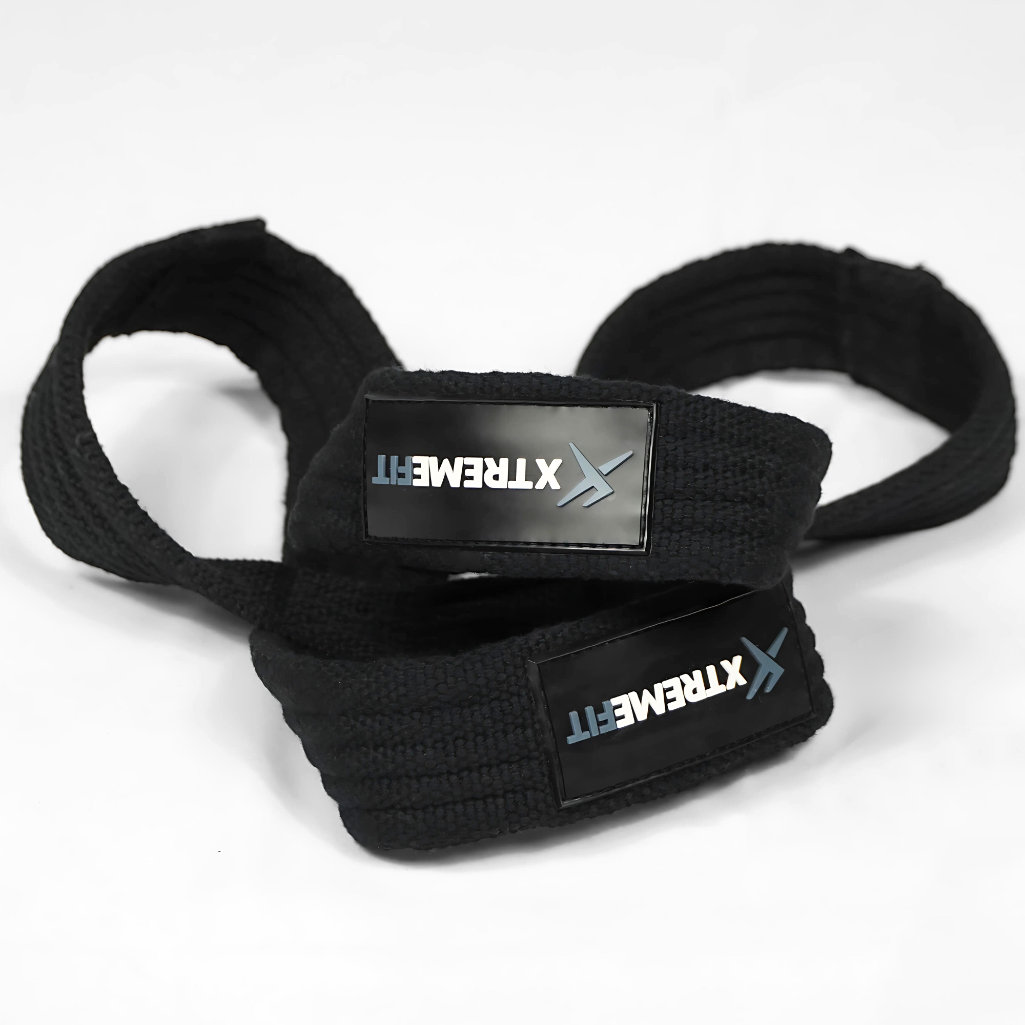 Figure 8 lifting straps xtremefit au sol. Idéal pour soulager le gripp et les avants-bras en muscu, powerliting, haltérophilie. Haute qualité, sangle en 8