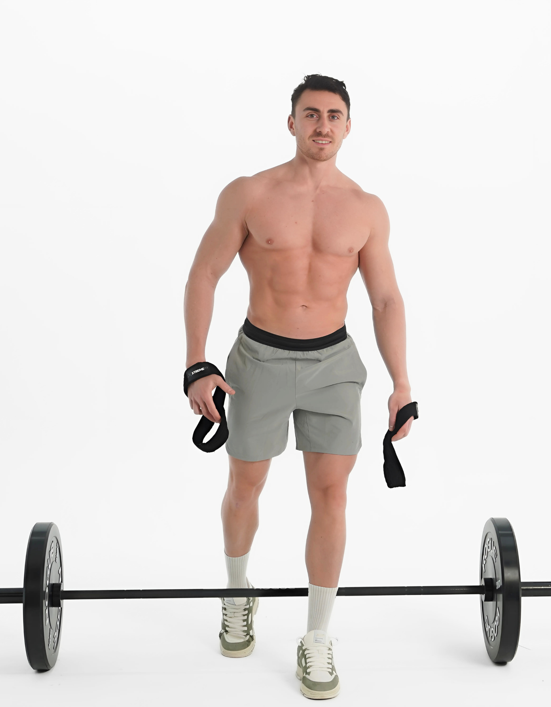 Athlète avec des sangles de musculation en forme de 8 xtremefit en coton renforcer idéal pour les exercices de levage